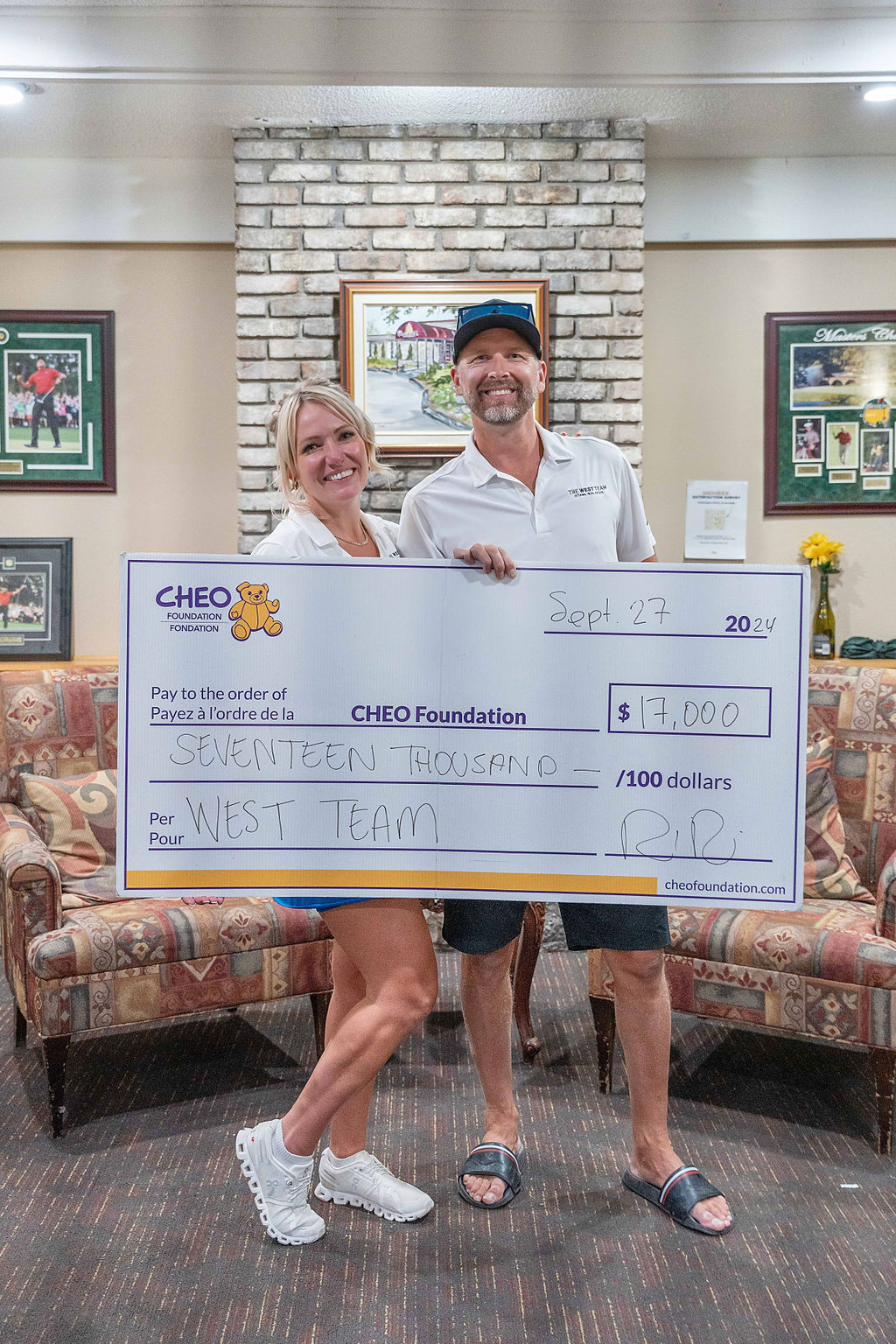 Richelle and Josh West holding a $17,000 donation cheque for the CHEO Foundation