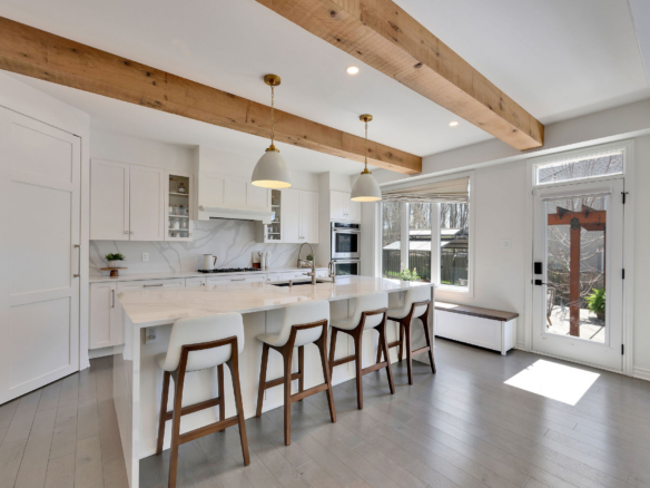 Bright, professionally presented kitchen with a large island and pendant lighting